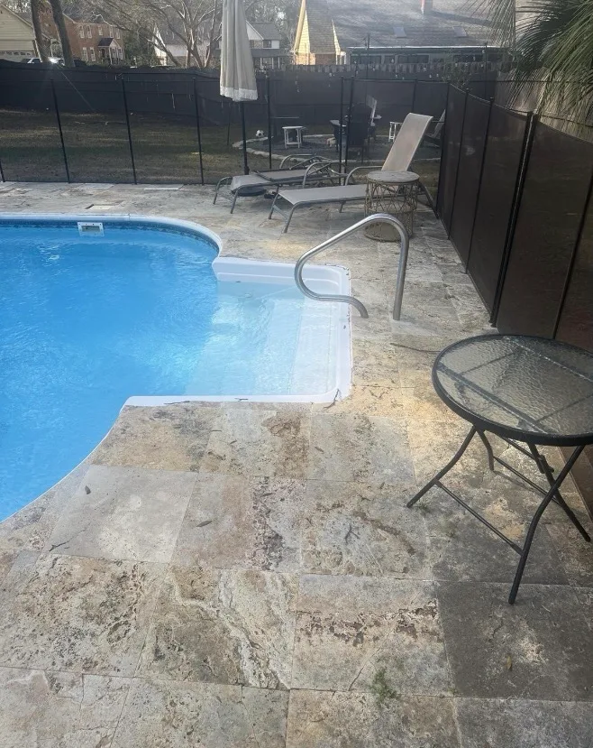 Before: pool deck cleaning on travertine pavers